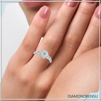 Rose gold flower ring featuring a three stone engagement style.
