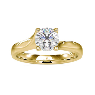 Round prong engagement ring with a solitaire diamond in gold.
