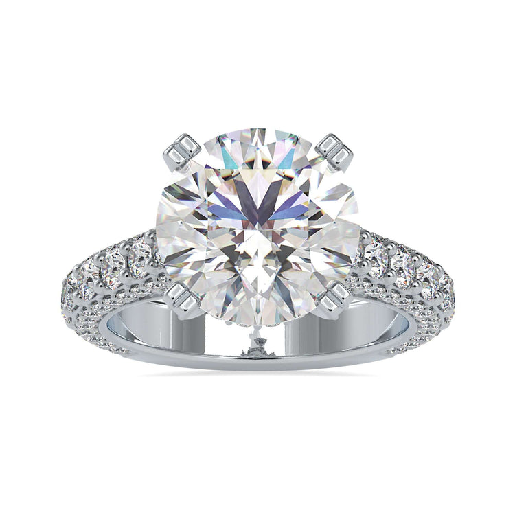 Three row pave engagement ring with a round diamond center.

