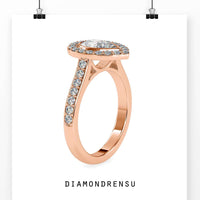 Teardrop wedding ring with pear shape and elegant halo design.
