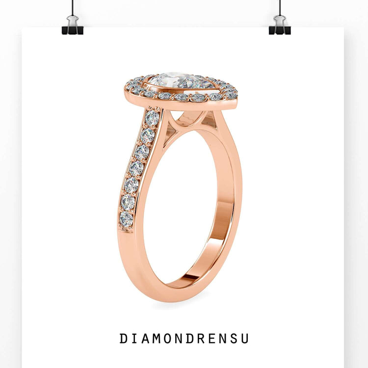 Teardrop wedding ring with pear shape and elegant halo design.
