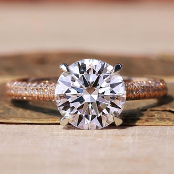 Double hidden halo engagement ring with round diamond.
