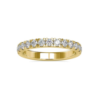 Gold wedding band for women featuring a half eternity diamond band design.

