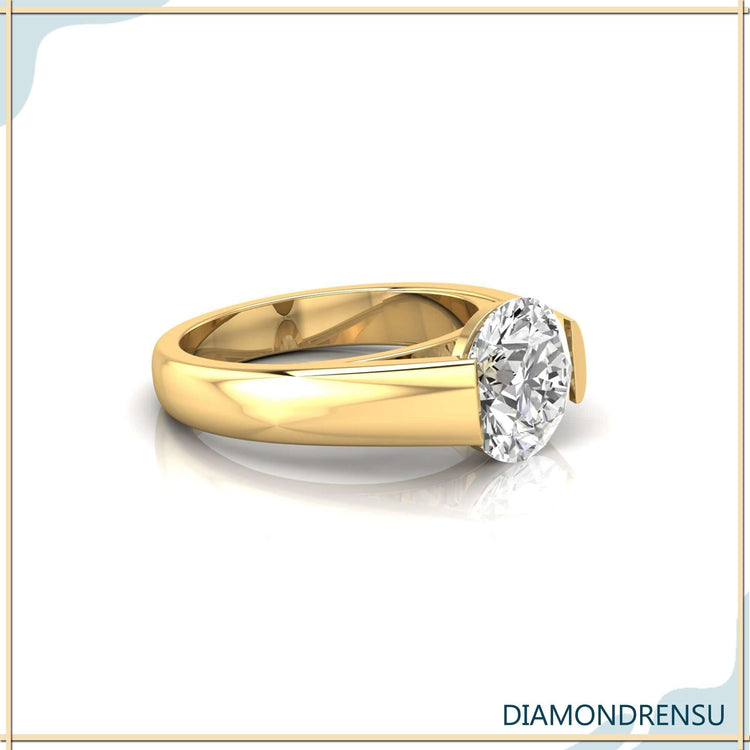 Yellow gold wedding band for men with a round diamond centerpiece.
