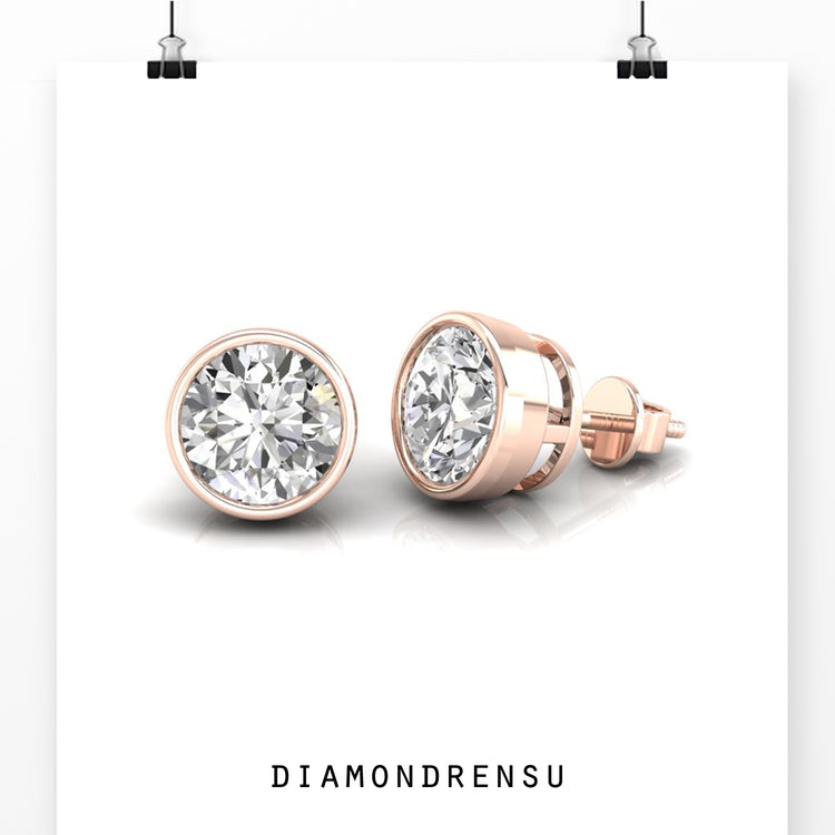 Dazzling diamond bezel stud earrings in a round design for everyday elegance.

