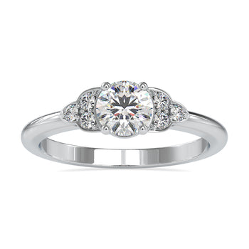 Round diamond engagement ring with a shared prong setting in white gold
