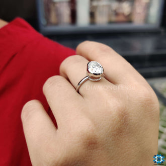 Handmade jewelry featuring a beautiful oval solitaire ring.
