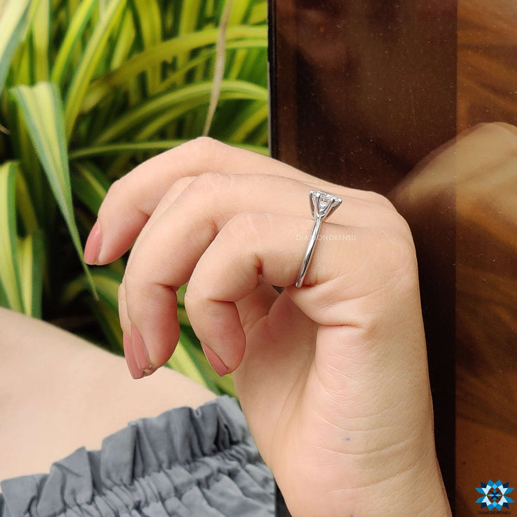 Solitaire engagement ring with a sleek and modern finish.