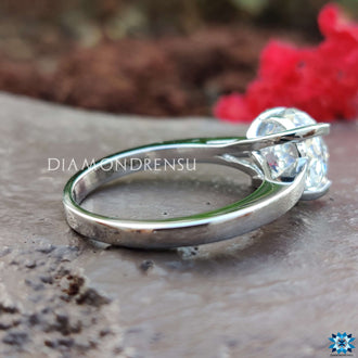 Portuguese cut moissanite set in a handcrafted engagement design.

