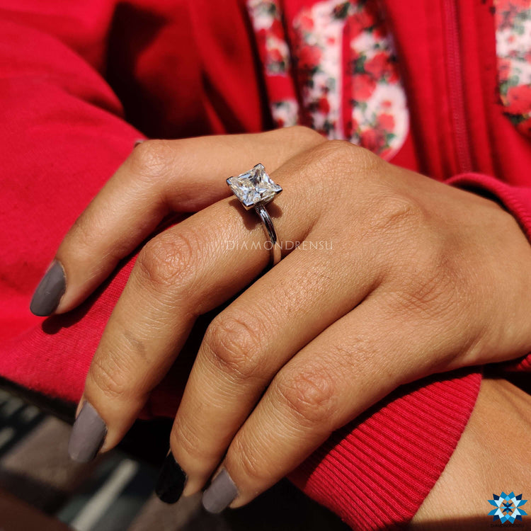 A beautiful 2 ct princess cut engagement ring set in a white gold V prong setting marquise design.