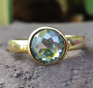 Bezel set engagement ring featuring a timeless design.