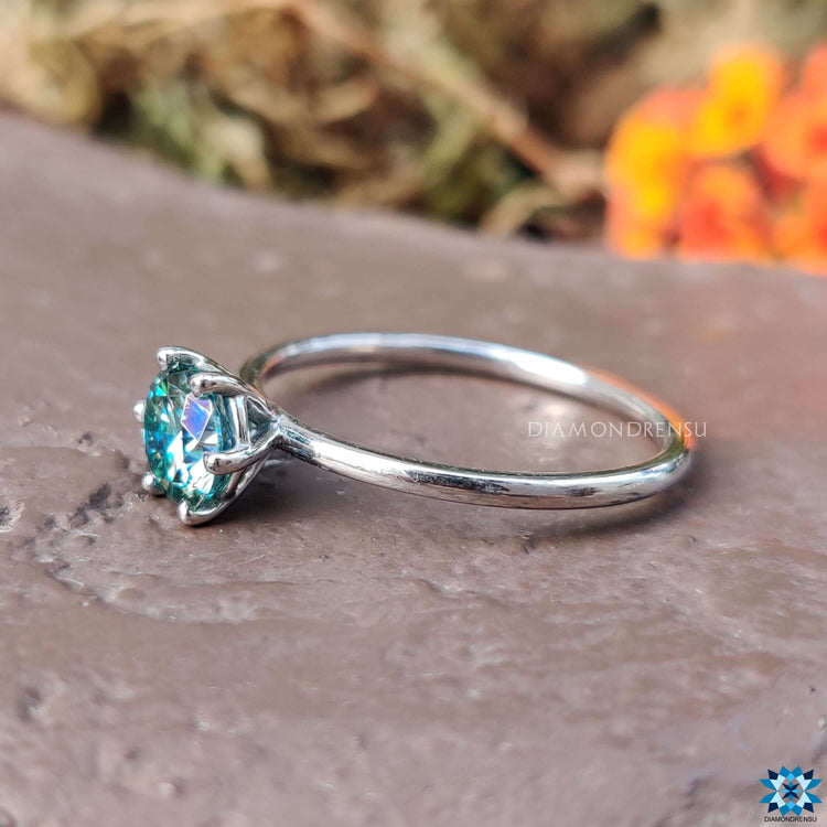 A 6 prong solitaire engagement ring featuring a timeless round gemstone.