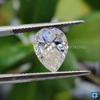 Pear cut moissanite reflecting moissanite stone brilliance.
