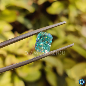 1.85 carat moissanite radiant cut in bright blue, available as a loose stone.
