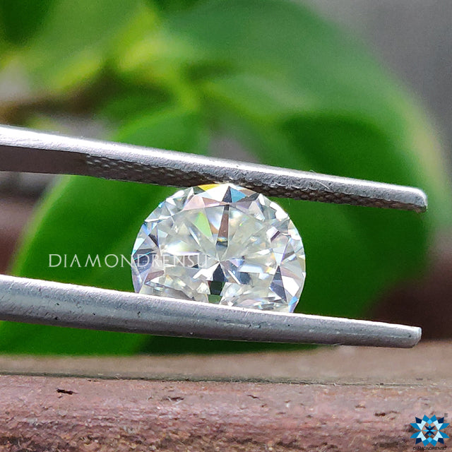 Off white green moissanite sold as 1.90 carat moissanite.
