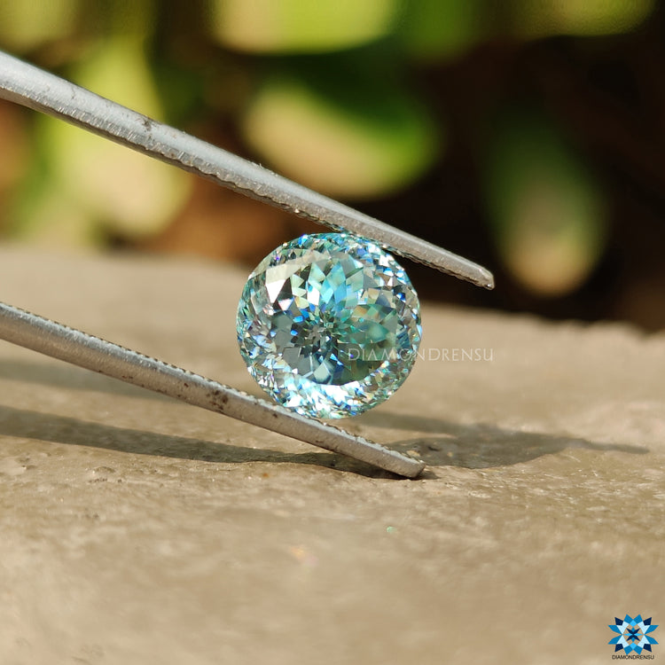 Portuguese cut cyan blue moissanite shown as a single loose stone.

