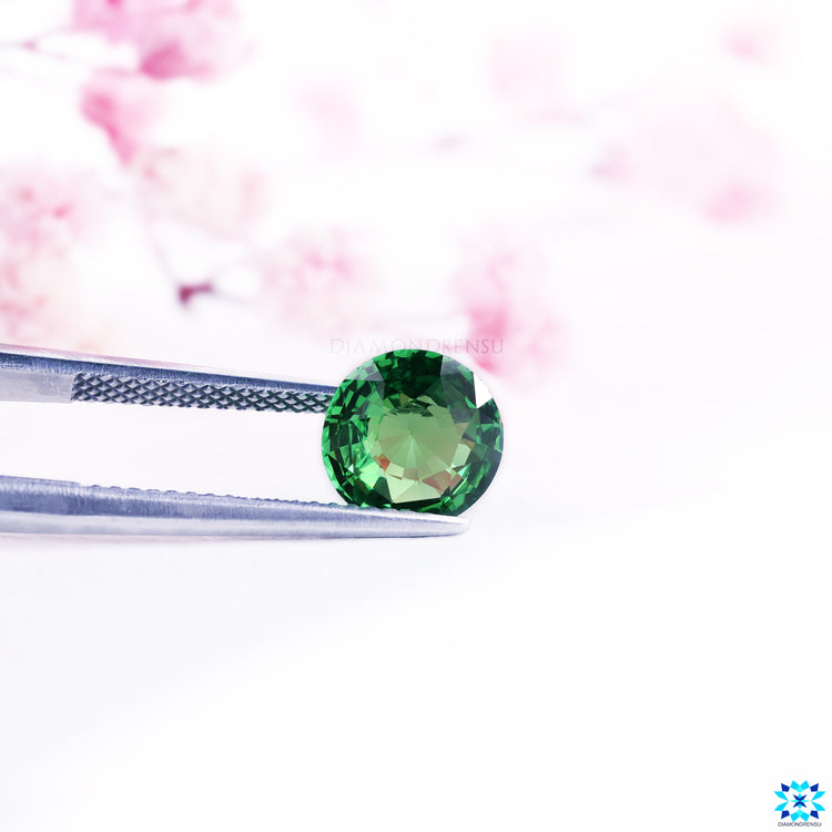Gemstone green styled in round cut gemstone shape.
