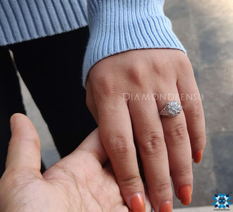 Round solitaire engagement ring set in a refined band, emphasizing its beautiful central stone