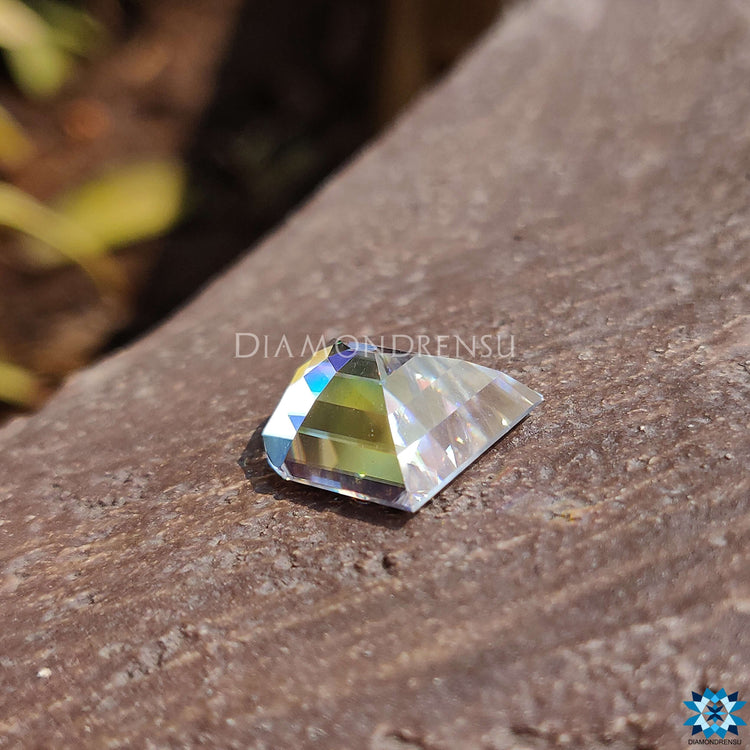 Antique cut loose moissanite with a 6.57 carat weight in elephant tooth design.
