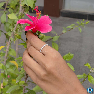 Shared prong eternity band with sparkling moissanite stones.