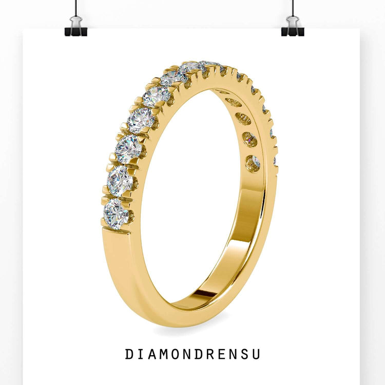 Half eternity band with rounded diamonds and a pave band style.
