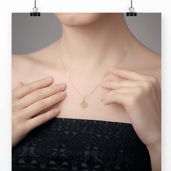 The small gold pendant adds a delicate and classic touch.

