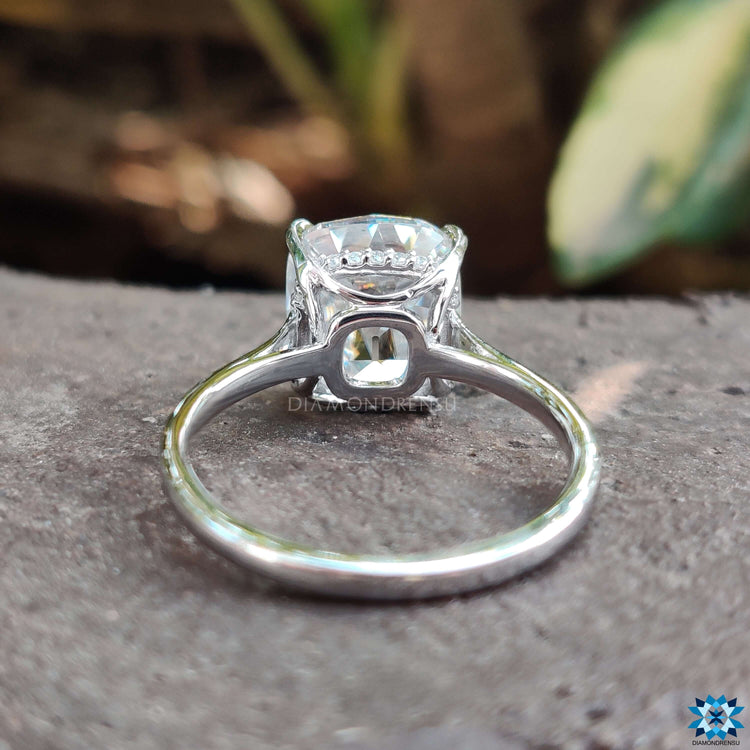 Unique cathedral moissanite ring with fine detailing.
