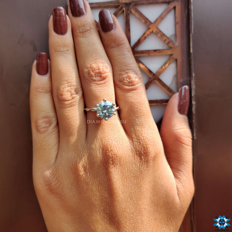 Prong setting ring with intricate twist design and brilliance.
