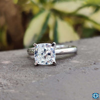 Radiant cushion cut moissanite engagement ring with prong setting.
