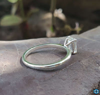 Solitaire emerald ring crafted for lasting impressions.