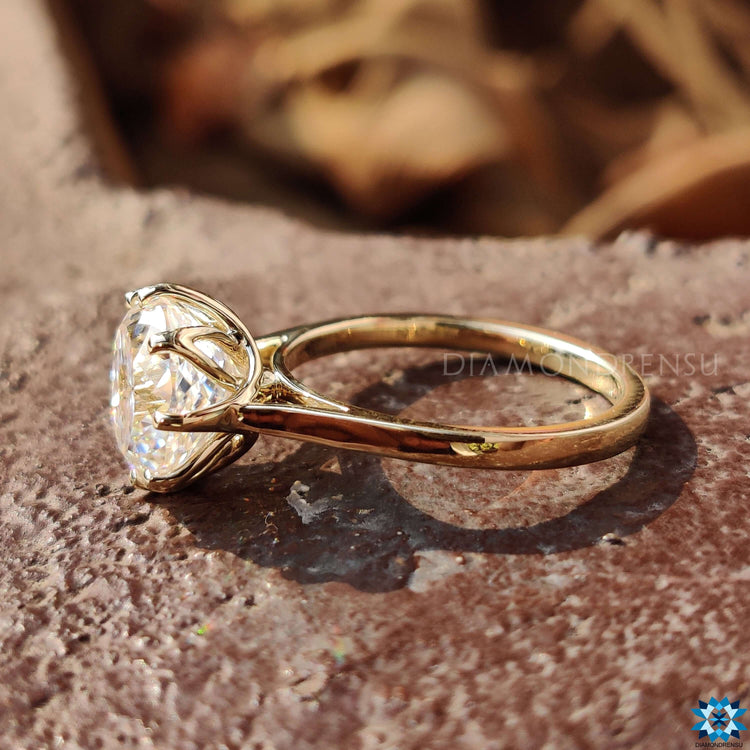 Exquisite Portuguese Cut Moissanite in a solitaire setting.