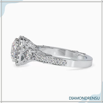 Round cut diamond ring in a classic vintage gold setting.
