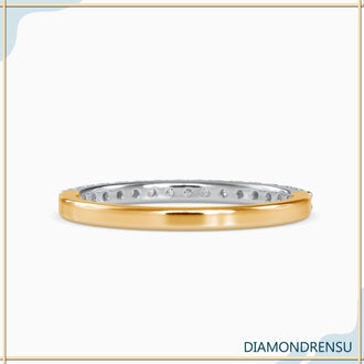 Diamond band for women with round diamonds in a 4-prong 
engagement style.
