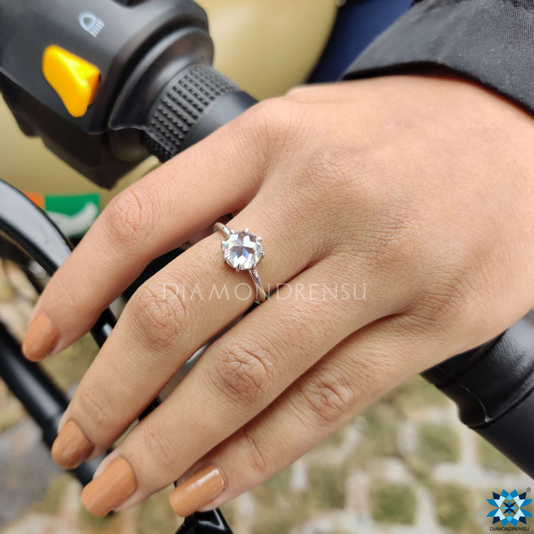 Round cut moissanite engagement ring showcasing timeless beauty.
