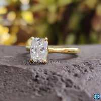 Elegant elongated cushion cut solitaire ring for engagements.