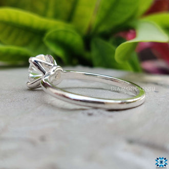 4 prong solitaire engagement ring with a sleek design
