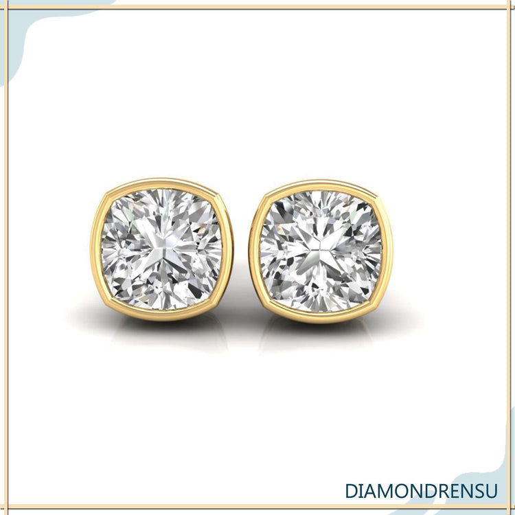 Timeless cushion cut stud earrings, featuring a bezel set stud earrings design.
