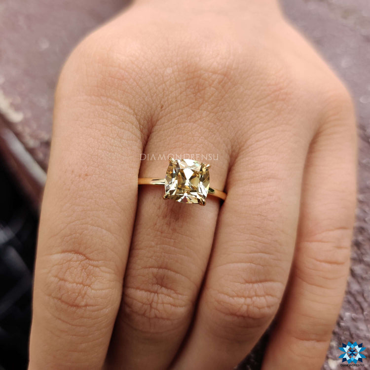 Exquisite cushion engagement ring crafted with precision, featuring a claw prong design.