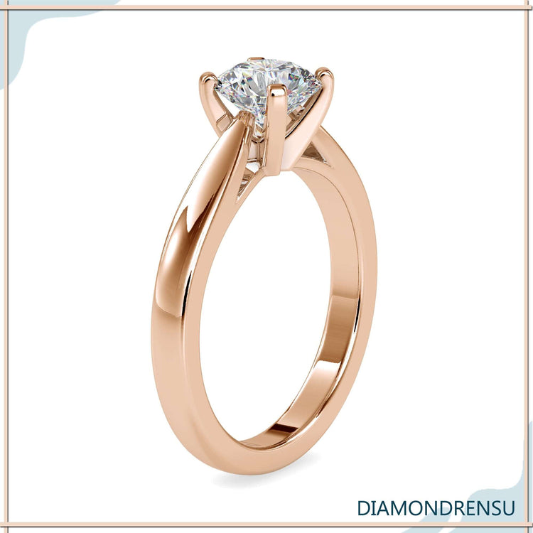 Round diamond engagement ring with simple solitaire design in white gold
