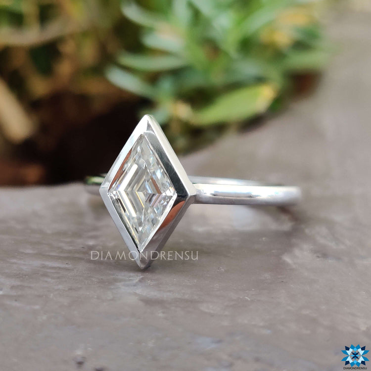 Elegant lozenge cut engagement ring on display.
