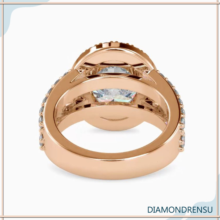 Oval cut diamond engagement ring with a baguette diamond halo.
