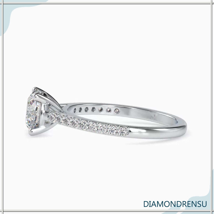 Elegant round diamond ring with a pavé setting and a cathedral style engagement ring design.