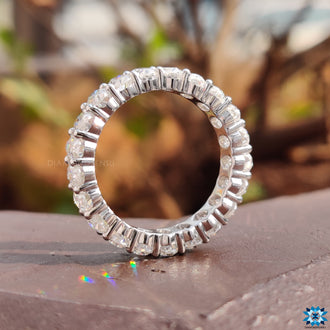 Classic eternity band oval with brilliant , symbolizing forever love in a timeless design.