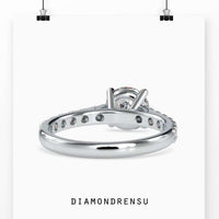 Classic round engagement ring in a cathedral setting with a four prong engagement ring design.
