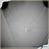 The cross pendant necklace symbolizes faith and elegance.

